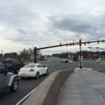 cars stop at the red light of a diverging diamond intersection