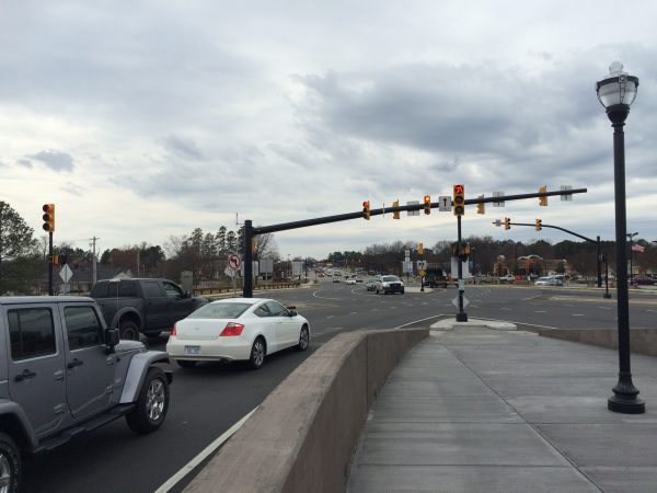 cars stop at the red light of a diverging diamond intersection