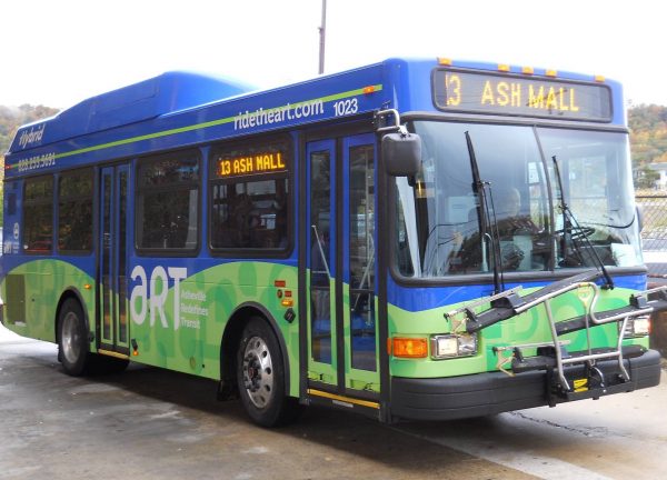 An active ART bus in Asheville shows the 13 Ash Mall stop